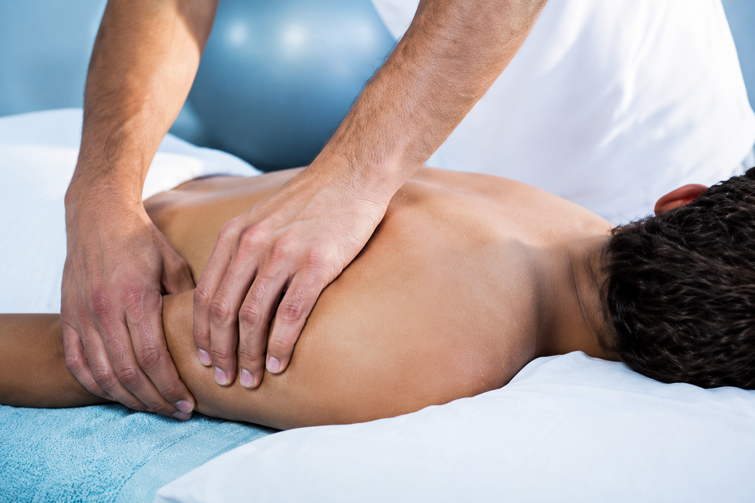 Therapist consulting with client at Bodies in Balance Massage